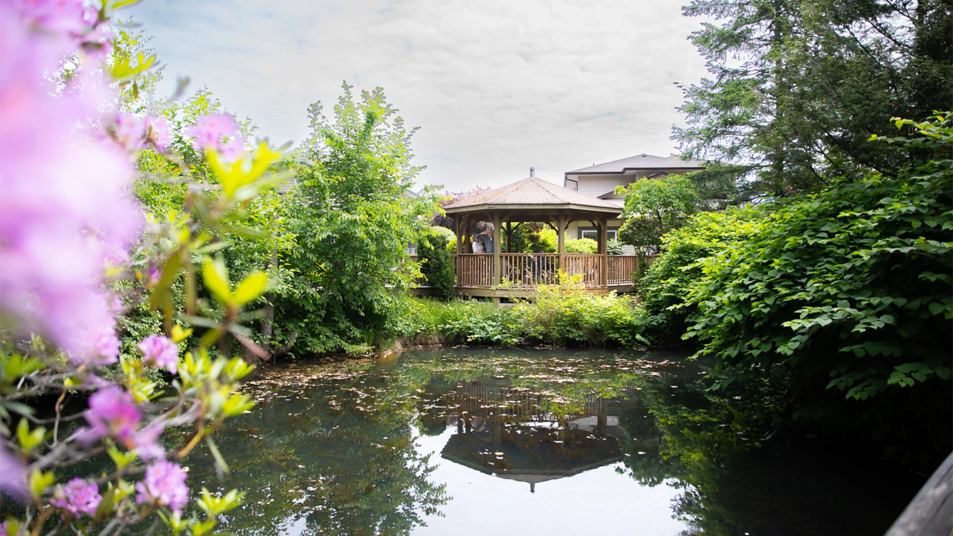 Chilliwack lifestyles building in front of a beautiful pond